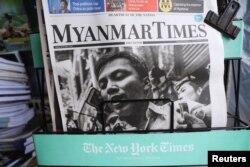 A Myanmar newspaper displays the story about the sentences received by Reuters journalists Wa Lone and Kyaw Soe Oo, on its front page in Yangon, Myanmar, Sept. 4, 2018.
