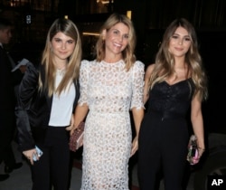 Actress Lori Loughlin, center, is seen with her daughters Isabella Rose Giannulli and Olivia Jade Giannulli in Los Angeles, Calif.