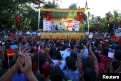 Myanmar pro-democracy leader Aung San Suu Kyi speaks during her campaign rally for the upcoming general elections in Toungup, Rahine state, October 16, 2015.
