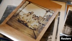 Family photos belonging to Takashi Odajima, who runs a seafood company manufacturing 'Shio-kara', a traditional fermented squid dish, and other seafoods, are seen at his family factory in Hakodate, on Japan's northern island of Hokkaido, July 19, 2018.