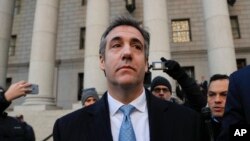Michael Cohen walks out of federal court Nov. 29, 2018, in New York, after pleading guilty to lying to Congress about work he did on an aborted project to build a Trump Tower in Russia. Cohen said he lied to be consistent with President Trump's "political
