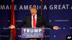 Republican presidential candidate Donald Trump speaks at a rally aboard the aircraft carrier USS Yorktown in Mount Pleasant, S.C., Dec. 7, 2015. He defended his plan to stop Muslims from entering the country. 