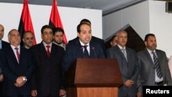 Libya's new Prime Minister Ahmed Maiteeq speaks at a news conference with members of the government in Tripoli, June 2, 2014. 