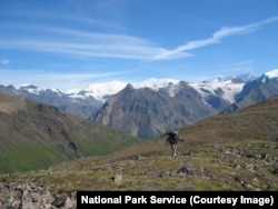 A backpacker hikes in the backcountry area of Wrangell-St. Elias National Park
