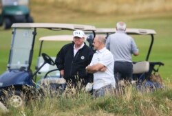 FILE - U.S. President Donald Trump waits on the fourth tee at Turnberry golf course, Scotland, July 14, 2018.