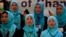 FILE - Girls sing the Afghan national anthem at an event in Kabul, Afghanistan, Sept. 26, 2013.