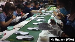 The rise of the textile industry, which includes factory-made shoes like these in Vietnam's Dong Nai province, has brought increasing cooperation between Chinese and Vietnamese businesses.