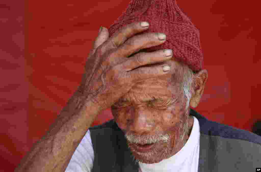 Funchu Tamang, who believes himself to be 101 years old, recounts how he suffered injuries in the recent earthquake, though he believes that he is fortunate to be alive, in the village of Kimtang, May 4, 2015.&nbsp;