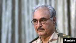 General Khalifa Haftar attends a news conference in Abyar, east of Benghazi, May 17, 2014.