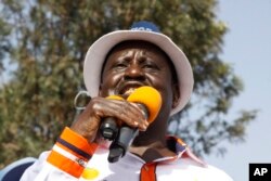 Kenyan opposition leader Raila Odinga addresses a crowd of his supporters in the Kibera area at an election rally in Nairobi, Kenya, Sept. 12, 2017.