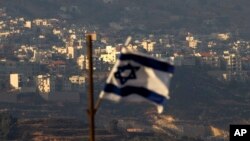 Izraelska zastava na Golanskoj visoravni (Foto: AP/Ariel Schalit)