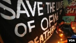 Warga Manila menggelar doa bersama untuk penyelundup Filipina yang dijatuhi hukuman mati di Tiongkok (7/12).