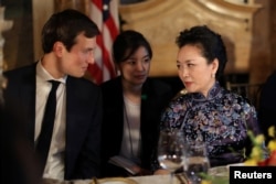 FILE - China's first lady Peng Liyuan talks with Trump Senior Adviser Jared Kushner as they attend a dinner at the start of a summit between U.S. President Donald Trump and Chinese President Xi Jinping at Trump's Mar-a-Lago estate in West Palm Beach, Florida.