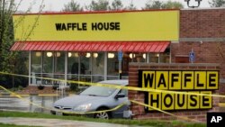A reveler depicting a grim reaper runs during a traditional St. Nicholas procession in the village of Valasska Polanka, Czech Republic, Dec. 7, 2019.