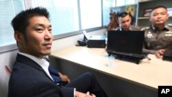 The leader of the political party named Future Forward Party, Thanathorn Juangroongruangkit arrives at the Technology Crime Suppression Division to hear police charges in Bangkok, Thailand, Monday, Sept. 17, 2018. 