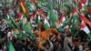 Supporters of Pakistan Democratic Movement gather during an anti-government rally in Lahore on Dec. 13, 2020. 