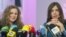 Two members of Russian punk group Pussy Riot, Nadezhda Tolokonnikova (R) and Maria Alyokhina (L), answer journalists' questions during their news conference in Moscow on December 27, 2013. 