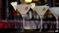 FILE - Frozen lemon daiquiris sit on the counter of the Floridita bar in Havana, Cuba, July 23, 2015. 