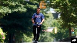 A man rides an electric scooter in Atlanta, Georgia, Aug. 8, 2019.