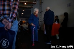 In this February 19, 2019 photo, a group of retired seniors from Laguna Woods Village attend a presentation organized by cannabis product vendors at Bud and Bloom cannabis dispensary in Santa Ana, California.