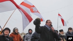 Belarus opposition activist Vyacheslav Sivchik speaks during a protest against the country's closer integration with Russia, which protesters fear could erode the post-Soviet independence of Belarus, in Minsk, Belarus, Dec. 29, 2019. 