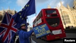 Anti-Brexit protesters demonstrate opposite the Houses of Parliament in London, Britain, January 16, 2018.