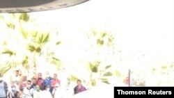 An ambulance is seen following a blast at a market in Togoga, west of Mekelle, in Ethiopia's Tigray region.