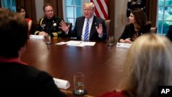 President Donald Trump speaks during a roundtable on immigration policy in California, in the Cabinet Room of the White House, May 16, 2018, in Washington. 