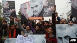 Pakistani Shi'ite Muslim protest the killing of top Iranian commander Qassem Soleimani in Iraq, outside the U.S. consulate in Lahore, Jan. 7, 2020. 