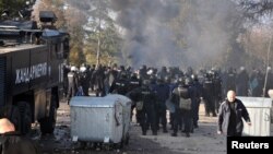 Bulgarian riot police are seen inside a refugee center during clashes in the town of Harmanli, Bulgaria, Nov. 24, 2016. 