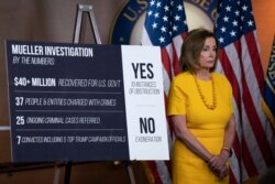 Speaker of the House Nancy Pelosi, D-Calif., stands beside a chart during a news conference following the back-to-back hearings with former special counsel Robert Mueller, July 24, 2019.