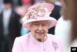 FILE - Her Majesty Queen Elizabeth II during a garden party at Buckingham Palace in London, England, UK.