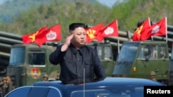 FILE - North Korea's leader Kim Jong Un inspects artillery launchers ahead of a military drill marking the 85th anniversary of the establishment of the Korean People's Army (KPA), April 25, 2017.
