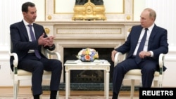 Presiden Rusia Vladimir Putin dan Presiden Suriah Bashar al-Assad di Kremlin, Moskow, Rusia, 13 September 2021. (Sputnik/Mikhail Klimentyev/Kremlin via REUTERS)