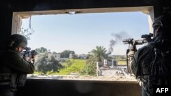 This handout picture released by the Israeli army on Jan. 23, 2024, shows Israeli soldiers operating in the Gaza Strip amid ongoing battles between Israel and the Palestinian militant group Hamas. (Photo by Israeli Army / AFP) 