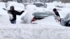 Snowstorm Slams Road, Air Travel in US Midwest