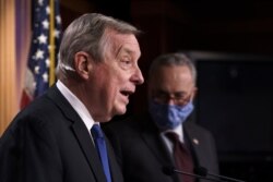 Sen. Dick Durbin, D-Ill., the majority whip, joined at right by Senate Majority Leader Chuck Schumer, D-N.Y., takes a question at a news conference at the Capitol in Washington, Feb. 2, 2021.