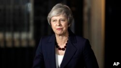 Britain's Prime Minister Theresa May delivers a speech outside 10 Downing Street in London, Nov. 14, 2018.