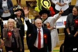 Britain's Labor Party leader Jeremy Corbyn waves after arriving for the declaration at his constituency in London, June 9, 2017.