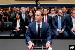 FILE - Facebook CEO Mark Zuckerberg arrives to testify before a House Energy and Commerce hearing on Capitol Hill in Washington, Wednesday, April 11, 2018. (AP Photo/Andrew Harnik)