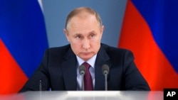 Russian President Vladimir Putin attends a meeting during his visit to Samara, Russia, March 7, 2018. Putin had more words of praise for U.S. President Donald Trump in a documentary released March 7 but expressed disappointment with the U.S. political system. 