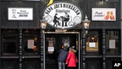 A restaurant demands the 2G rule, that means only vaccinated or recovered customers are allowed to enter in Cologne, Germany, Jan. 7, 2022. New