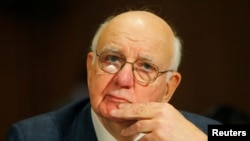 FILE - Former Federal Reserve Bank Chairman Paul Volker listens to opening statements in the confirmation hearing for New York Federal Reserve Bank President Timothy Geithner, President Barack Obama's nominee for treasury secretary, Jan. 21, 2009.