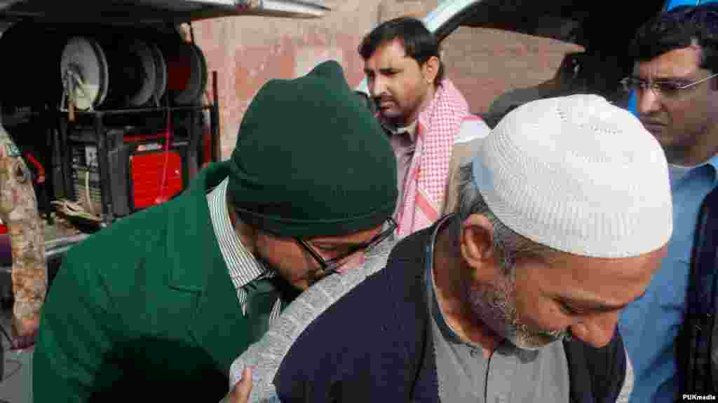A student cries on a man&#39;s shoulder, after he was rescued from the school that was attacked by Taliban gunmen in Peshawar, Pakistan, Dec. 16, 2014.