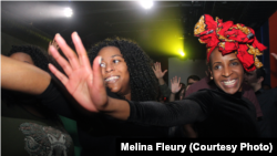 Audience members in Washington, D.C. dance to songs by Caique Vidal, who performed at Tropicalia during Carnaval.