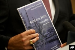 Puerto Rico Gov. Ricardo Rossello speaks during a news conference to urge Congress to include Puerto Rico in the Supplemental Disaster Relief Package, Nov. 13, 2017, in Washington.