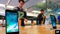 FILE - The Apple iPhone 7 is displayed at an Apple store at the Grove in Los Angeles, California, Sept. 16, 2016.