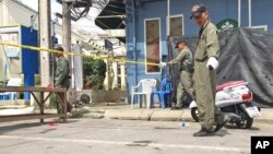Investigators work at the scene of an explosion in the resort town of Hua Hin, 240 kilometers (150 miles) south of Bangkok, Aug. 12, 2016. 
