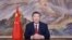 In this photo released by Xinhua News Agency, Chinese President Xi Jinping delivers a New Year message on Dec. 31, 2024 in Beijing to ring in 2025. (Ju Peng/Xinhua via AP)