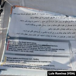 A sign near the Mantamados migrant camp, which now sits empty, welcomes arriving migrants, April 3, 2016. That welcome no longer exists following the announcement of the EU Turkey deal.